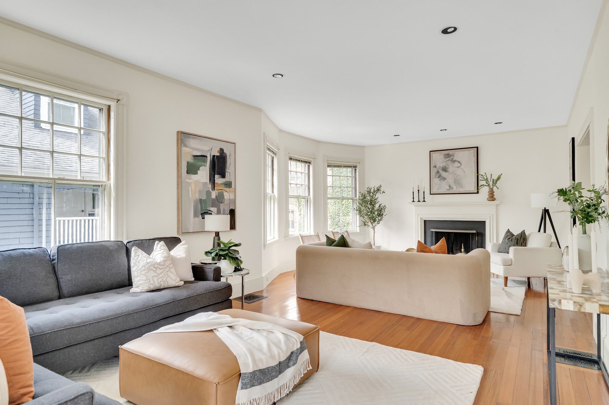 Bright and cozy living room with modern furniture and abstract art.